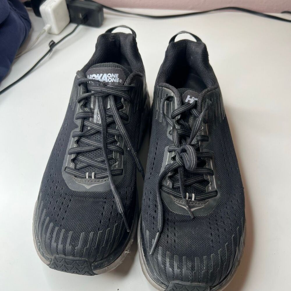 These are the black Hoka One One Clifton 5 running shoes featuring a breathable